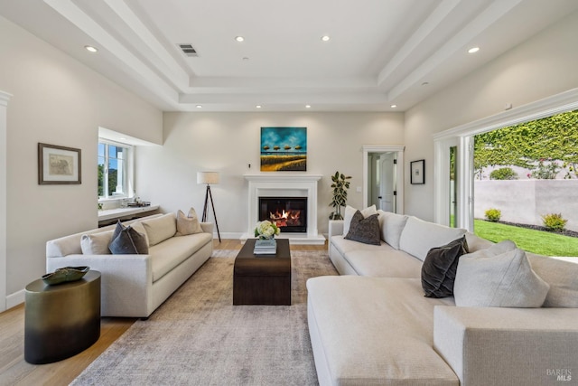 6 Live Oak Way, San Rafael, CA 94901 - living area with light wood finished floors, a raised ceiling, a glass covered fireplace, recessed lighting, and baseboards