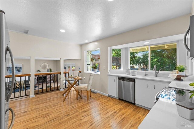 1503 Galaxy Ct, Rohnert Park, CA 94928 - kitchen featuring stainless steel dishwasher, a sink, light wood-type flooring, light countertops, and recessed lighting