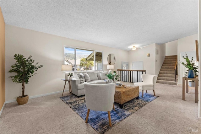 1503 Galaxy Ct, Rohnert Park, CA 94928 - living area featuring carpet, a textured ceiling, baseboards, and stairs