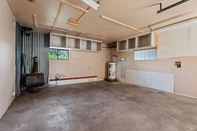 2840 Pear View Rd, Lakeport, CA 95453 - garage featuring secured water heater and a wood stove