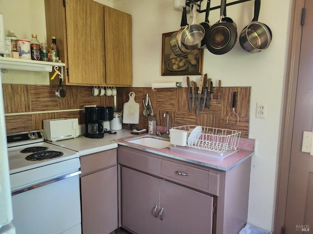 25500 Fairbanks Ln, Covelo, CA 95428 - kitchen with electric range, tasteful backsplash, light countertops, and a sink