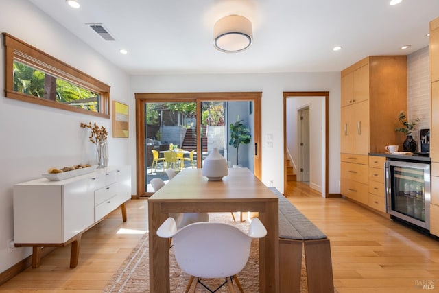 55 Durham Rd, San Anselmo, CA 94960 - dining space with beverage cooler, light wood-style flooring, recessed lighting, stairs, and baseboards