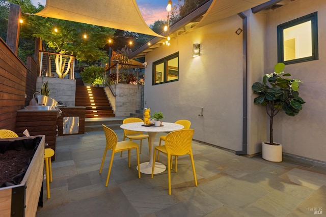 55 Durham Rd, San Anselmo, CA 94960 - patio terrace at dusk featuring stairway, outdoor dining area, and a patio area