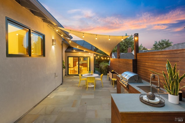 55 Durham Rd, San Anselmo, CA 94960 - patio terrace at dusk with a sink, a patio, and outdoor dining area