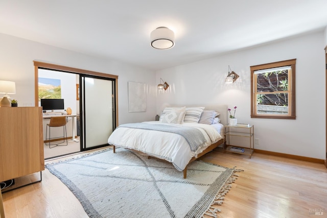 55 Durham Rd, San Anselmo, CA 94960 - bedroom featuring light wood-style floors, baseboards, and access to exterior