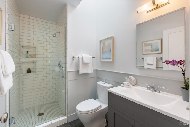 55 Durham Rd, San Anselmo, CA 94960 - bathroom featuring toilet, a shower stall, a wainscoted wall, vanity, and tile patterned flooring