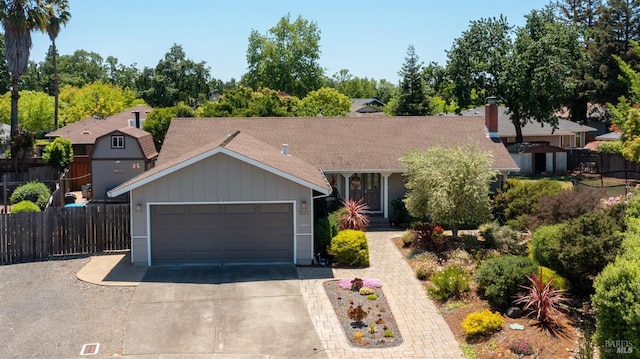 1523 Bruce Ct, Santa Rosa, CA 95401 - view of front of property featuring concrete driveway, an attached garage, board and batten siding, and a shingled roof