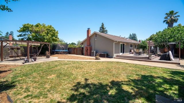 1523 Bruce Ct, Santa Rosa, CA 95401 - view of yard featuring a trampoline, a deck, a pergola, and central AC