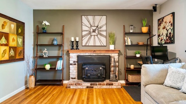 1523 Bruce Ct, Santa Rosa, CA 95401 - living area with wood finished floors, a brick fireplace, and baseboards