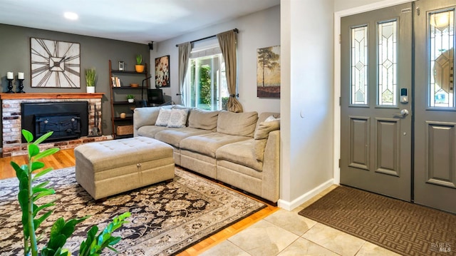 1523 Bruce Ct, Santa Rosa, CA 95401 - living room featuring a fireplace, baseboards, and light wood-type flooring