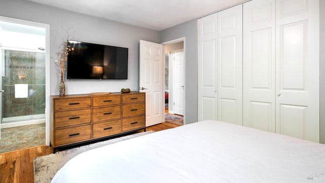 1523 Bruce Ct, Santa Rosa, CA 95401 - bedroom featuring wood finished floors, a closet, and connected bathroom