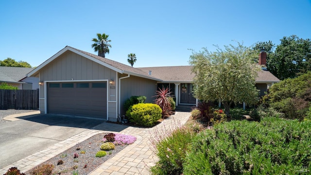 1523 Bruce Ct, Santa Rosa, CA 95401 - ranch-style home featuring an attached garage, concrete driveway, roof with shingles, and a chimney