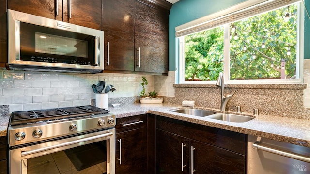 1523 Bruce Ct, Santa Rosa, CA 95401 - kitchen with stainless steel appliances, a sink, dark brown cabinets, and decorative backsplash
