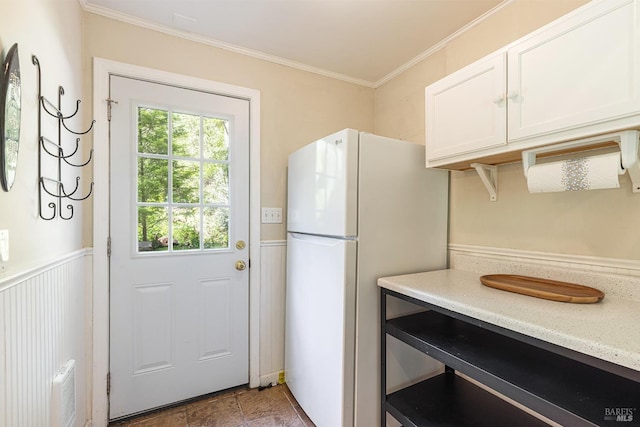 4011 Mill Creek Rd, Healdsburg, CA 95448 - kitchen featuring freestanding refrigerator, white cabinetry, and ornamental molding