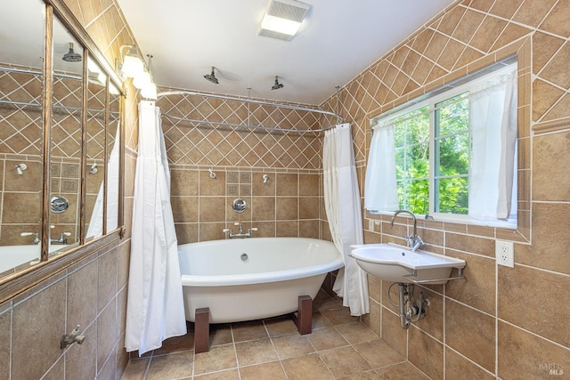 4011 Mill Creek Rd, Healdsburg, CA 95448 - full bathroom with tile walls, tile patterned floors, a sink, and a combined bath / shower with rainfall shower