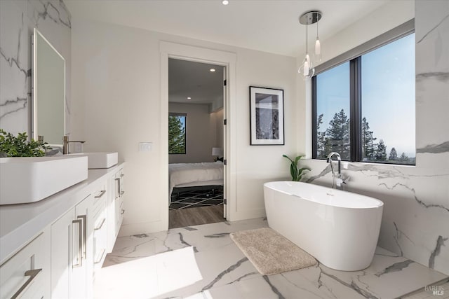 1994 W Bristlecone Ct, Santa Rosa, CA 95403 - full bathroom with marble tiled floors, connected bathroom, a soaking tub, double vanity, and recessed lighting