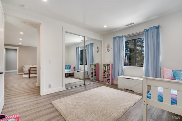 1994 W Bristlecone Ct, Santa Rosa, CA 95403 - bedroom with light wood-style flooring, recessed lighting, a closet, and baseboards