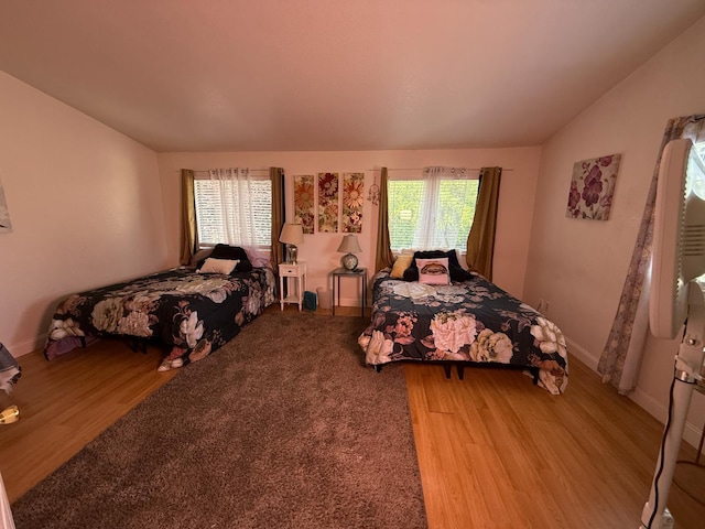 561 Samuel Way, Sacramento, CA 95838 - bedroom with light wood-type flooring, lofted ceiling, and baseboards