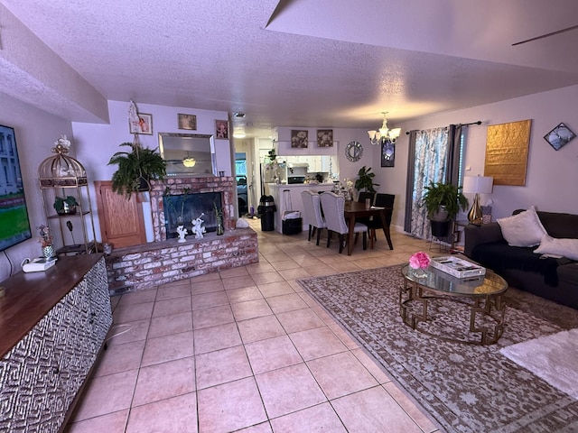 561 Samuel Way, Sacramento, CA 95838 - living area featuring a chandelier, tile patterned floors, a textured ceiling, and a brick fireplace
