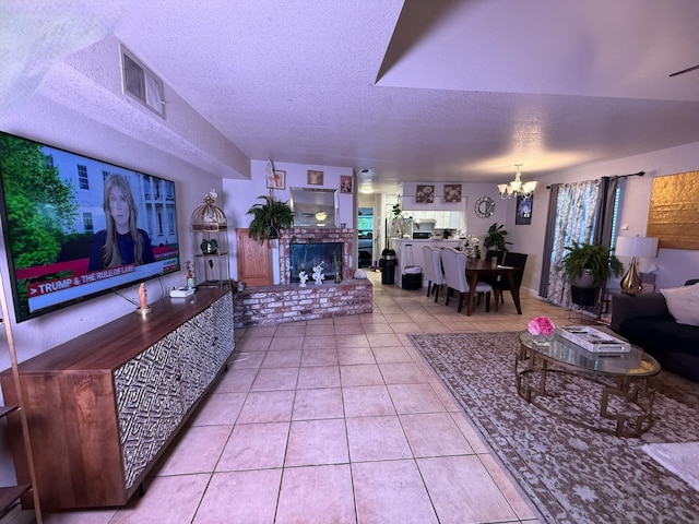 561 Samuel Way, Sacramento, CA 95838 - living room with a chandelier, tile patterned flooring, a textured ceiling, and a fireplace