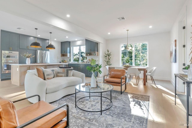 22 Cedar Ave, Kentfield, CA 94904 - living room featuring light wood-style floors, plenty of natural light, recessed lighting, baseboards, and a chandelier