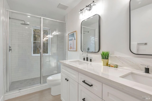22 Cedar Ave, Kentfield, CA 94904 - full bath with a shower stall, toilet, double vanity, and wood finished floors