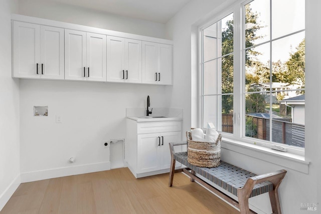22 Cedar Ave, Kentfield, CA 94904 - washroom featuring cabinet space, plenty of natural light, hookup for an electric dryer, and washer hookup