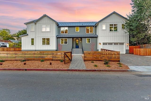 22 Cedar Ave, Kentfield, CA 94904 - view of front of property with board and batten siding, a standing seam roof, an attached garage, driveway, and metal roof