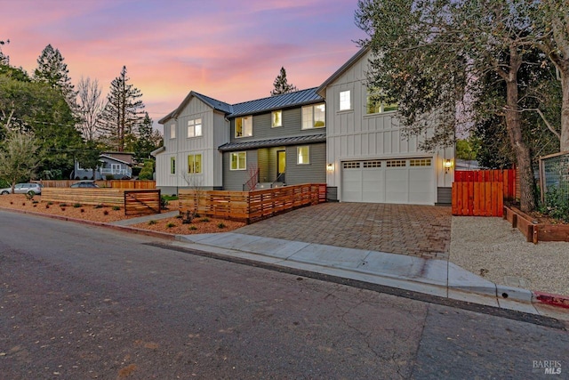 22 Cedar Ave, Kentfield, CA 94904 - view of front of property featuring board and batten siding, an attached garage, decorative driveway, a standing seam roof, and metal roof