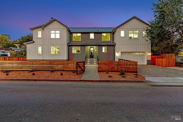 22 Cedar Ave, Kentfield, CA 94904 - view of front of home with a standing seam roof, a garage, decorative driveway, metal roof, and board and batten siding