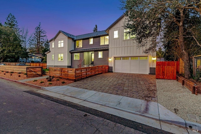 22 Cedar Ave, Kentfield, CA 94904 - view of front of house featuring board and batten siding, a garage, a standing seam roof, decorative driveway, and metal roof