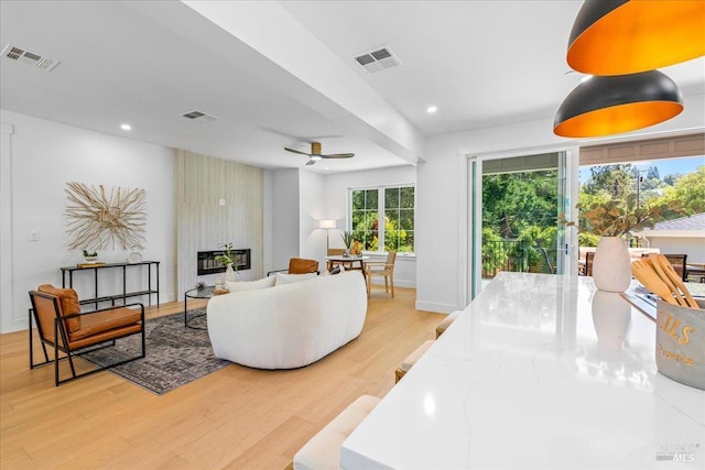 22 Cedar Ave, Kentfield, CA 94904 - living room featuring light wood-style floors, a fireplace, recessed lighting, a ceiling fan, and baseboards
