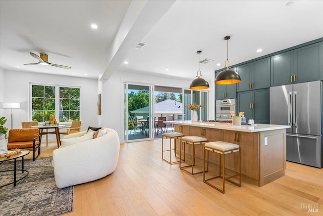 22 Cedar Ave, Kentfield, CA 94904 - kitchen featuring high end fridge, light countertops, light wood-type flooring, plenty of natural light, and recessed lighting