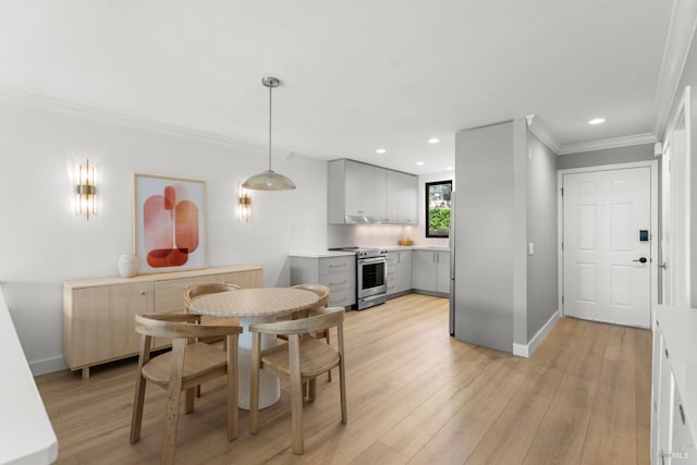 402 Donahue St, Sausalito, CA 94965 - dining room with ornamental molding, recessed lighting, light wood-type flooring, and baseboards