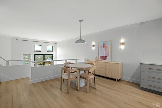402 Donahue St, Sausalito, CA 94965 - dining space with crown molding, light wood-style floors, and baseboards