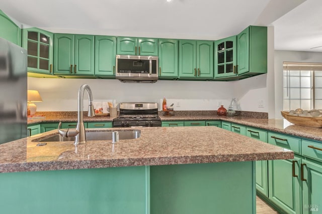 1753 15th St, San Pablo, CA 94806 - kitchen with appliances with stainless steel finishes, a sink, and glass insert cabinets
