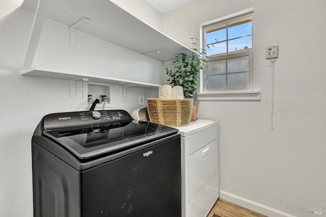 1753 15th St, San Pablo, CA 94806 - laundry room featuring washer and clothes dryer, light wood-style flooring, and baseboards