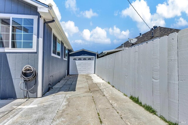1753 15th St, San Pablo, CA 94806 - view of side of property with driveway and a detached garage