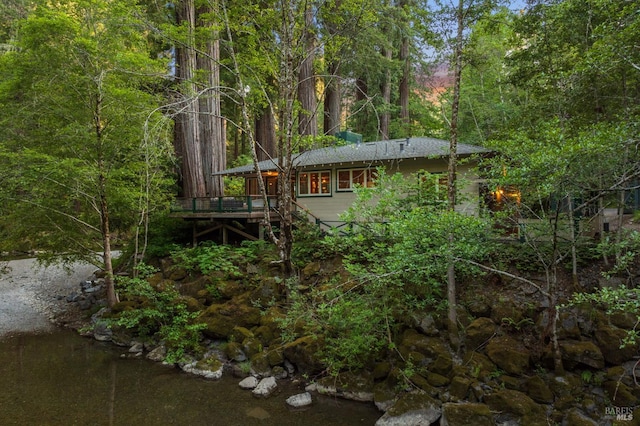 5600 Cazadero Hwy, Cazadero, CA 95421 - back of property with a wooden deck, a forest view, and stairway