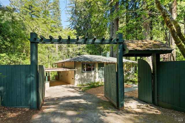 5600 Cazadero Hwy, Cazadero, CA 95421 - view of outbuilding featuring asphalt driveway, a gate, and a carport