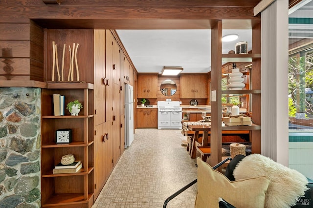 5600 Cazadero Hwy, Cazadero, CA 95421 - kitchen with white appliances, brown cabinetry, and light countertops