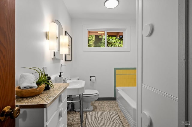 5600 Cazadero Hwy, Cazadero, CA 95421 - full bath with a bathtub, toilet, baseboards, tile patterned flooring, and a sink