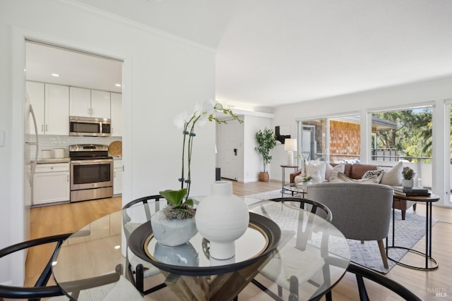 40 Redwood Ave, Corte Madera, CA 94925 - dining space with light wood-type flooring, crown molding, and recessed lighting