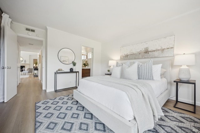 40 Redwood Ave, Corte Madera, CA 94925 - bedroom featuring wood finished floors, crown molding, and ensuite bath