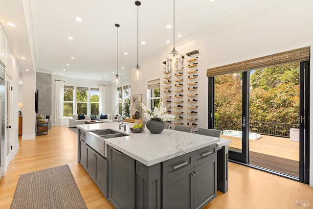 943 Appleridge Pl, Fairfield, CA 94534 - kitchen featuring gray cabinetry, an island with sink, light wood-style floors, open floor plan, and recessed lighting