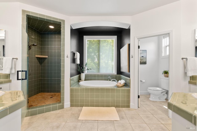 943 Appleridge Pl, Fairfield, CA 94534 - bathroom featuring vanity, a garden tub, tile patterned flooring, toilet, and a tile shower