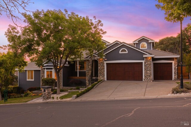 943 Appleridge Pl, Fairfield, CA 94534 - view of front of home featuring stone siding, an attached garage, and concrete driveway