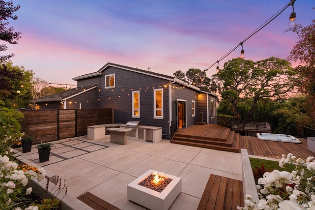 943 Appleridge Pl, Fairfield, CA 94534 - rear view of house with a fire pit, a wooden deck, a patio, and a hot tub