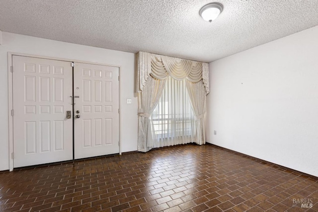 1417 Klamath Dr, Suisun City, CA 94585 - foyer with a textured ceiling, baseboards, and brick patterned flooring