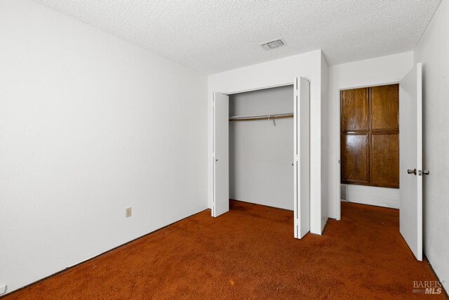 1417 Klamath Dr, Suisun City, CA 94585 - unfurnished bedroom with carpet flooring, a closet, and a textured ceiling